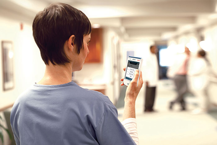 nurse holding a mobile call device