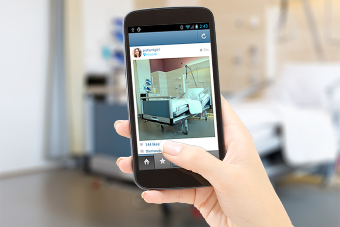 millennial sharing image of patient room on social media