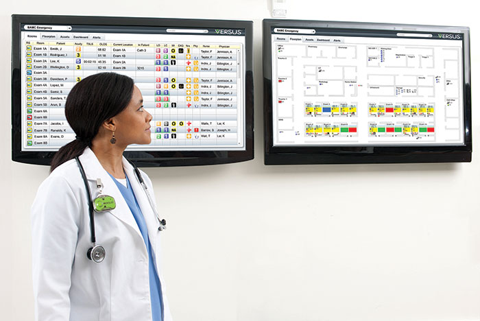 female clinician viewing RTLS screens