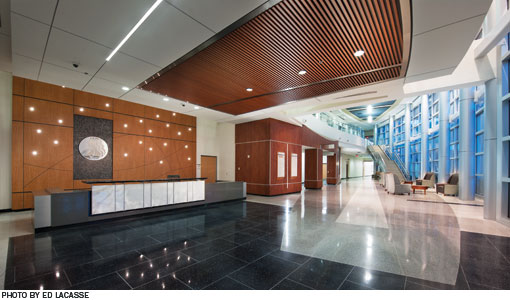 Interior entrance lobby of the hospital.  Tall ceilings and floor to ceiling windows make the lobby feel spacious 