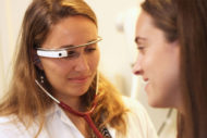 Doctor examining patient wearing Google Glass tech
