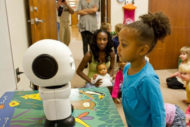 Children looking at Maki robot