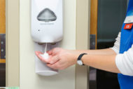 RN using soap dispenser
