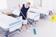 Woman cleaning hospital floor
