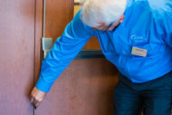 Man inspecting hospital door