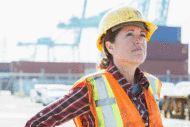 Female construction worker looking into distance