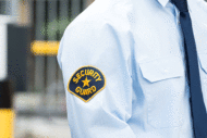Security guard with badge on arm