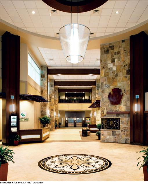 Enclosed walkways off each side of the entry lead to the women's center and MOB. To the right of the main lobby, there is a diagnostic waiting area for imaging and related services; to the left, is the surgical waiting room.