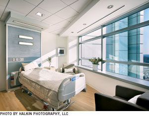 In this patient room, the bed is oriented to take advantage of daylight and equipment is minimized by a unique headwall configuration.