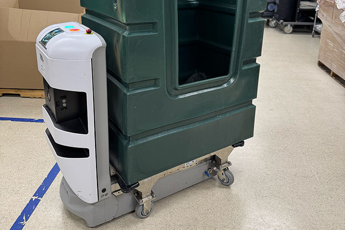 Robot hauling laundry cart