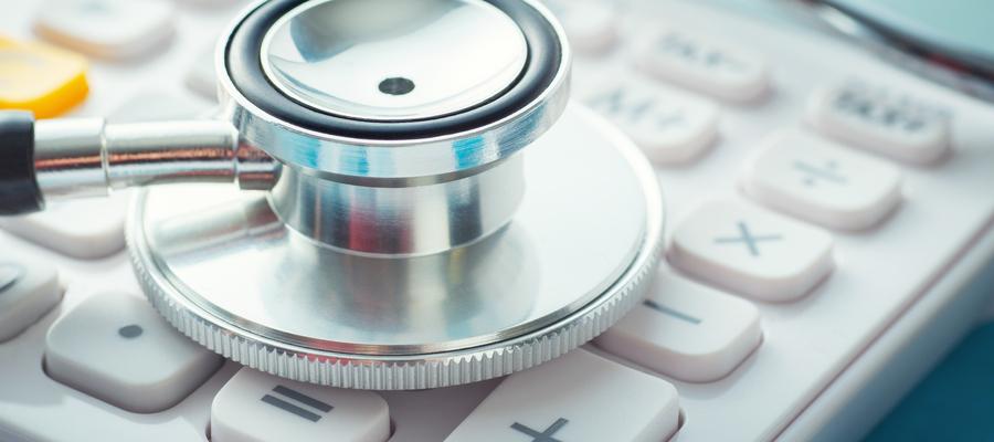 Stethoscope over a calculator keyboard