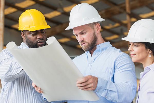Constructors looking at building plans
