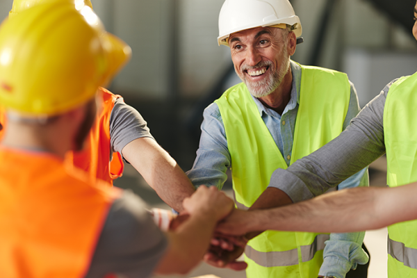 Construction team with hands in
