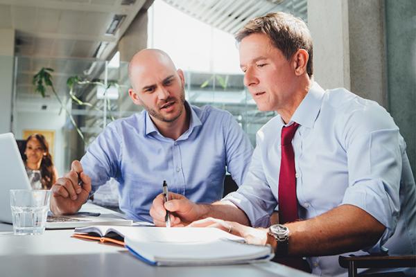 Colleagues looking over finances