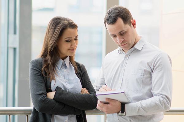Colleagues review documentation