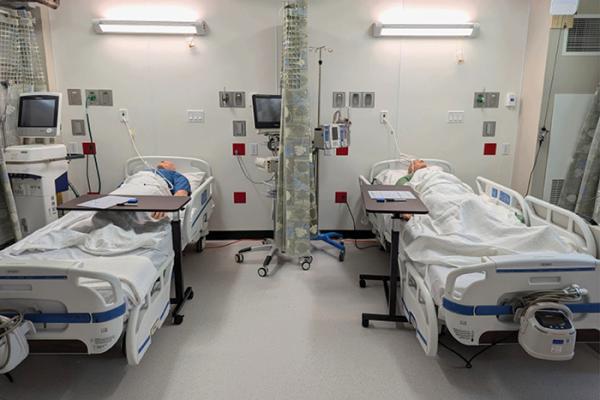 patient beds and hallways in alternate care conversion facility