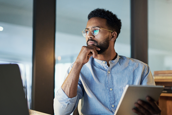 Man resting hand on chin in a pensive state