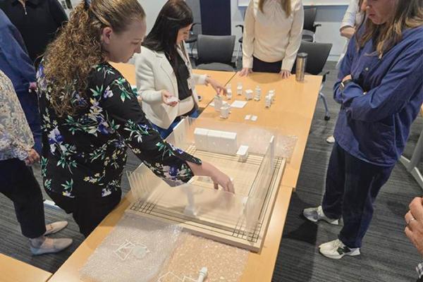 Staff at University of Kentucky Albert B. Chandler Hospital interact with 3D model pieces as part of operating room layout project