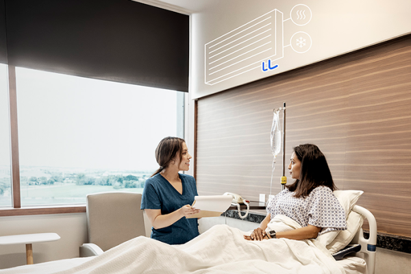Clinician talking to patient at bedside