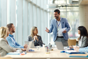 Male colleague leading meeting 