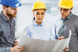 Engineers looking at building plans