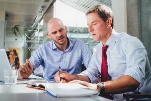 Colleagues looking over finances