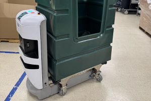 Robot hauling laundry cart