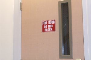 Fire door with "Fire door do not block" sign