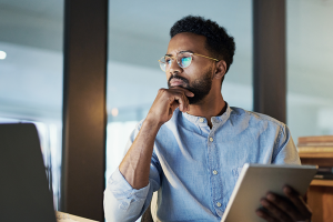 Man resting hand on chin in a pensive state