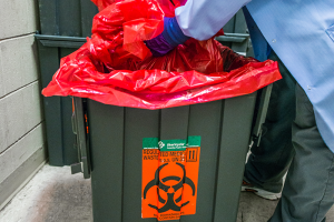 Person disposing of hospital hazardous waste